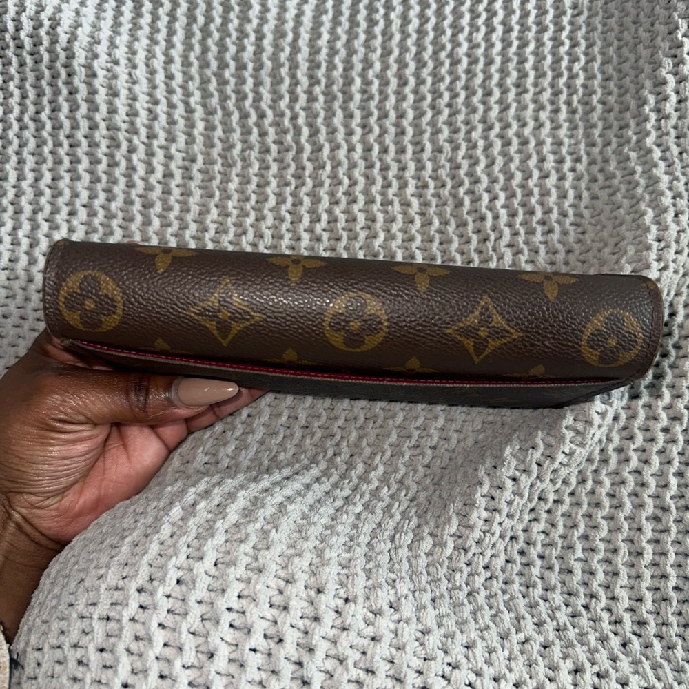 Authentic Louis Vuitton Sarah Wallet in Monogram with Fuschia interior - Picture 10 of 16
